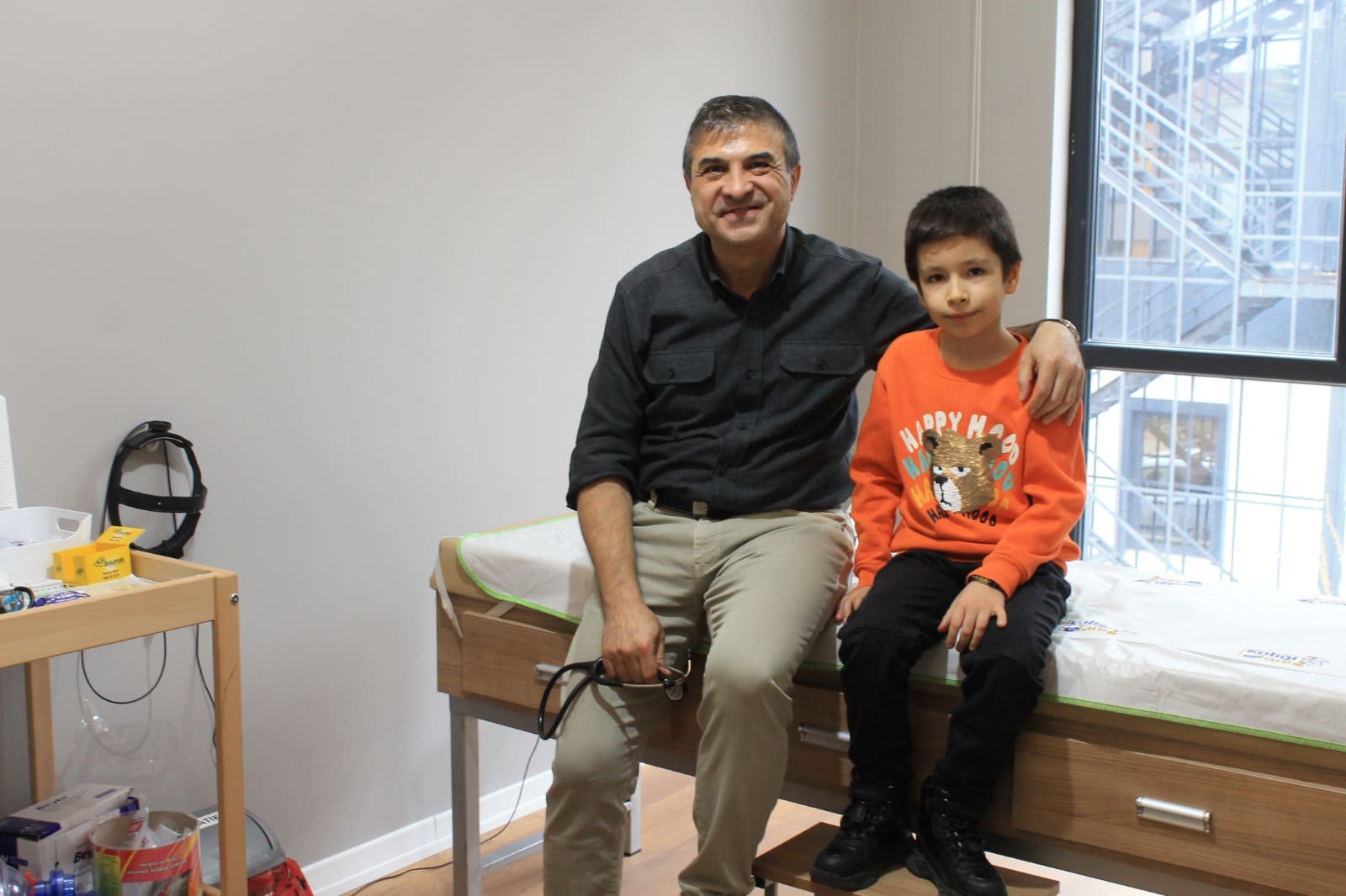 Dr. Yunus Emre Baysal with child